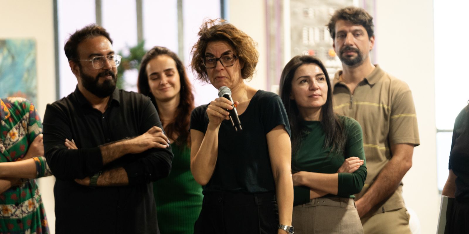 Confident senior leader presenting in a bright modern space